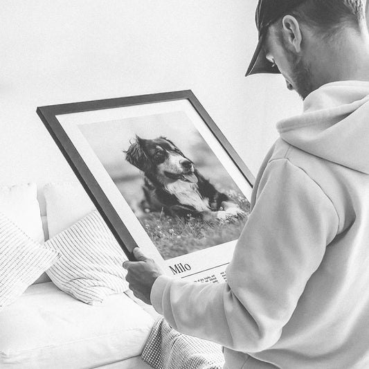 dad holding a father's day gift made for dog dads